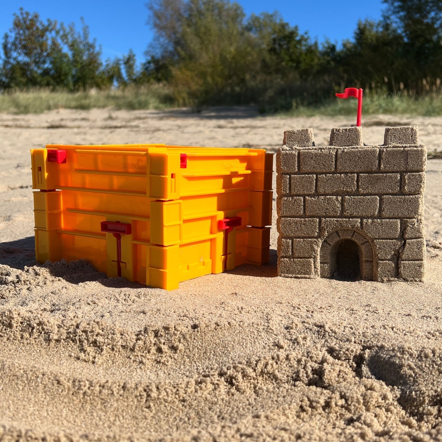 Sandmasons yellow sandcastle kit wall and tower forms for creating large sand and snow castle sections.